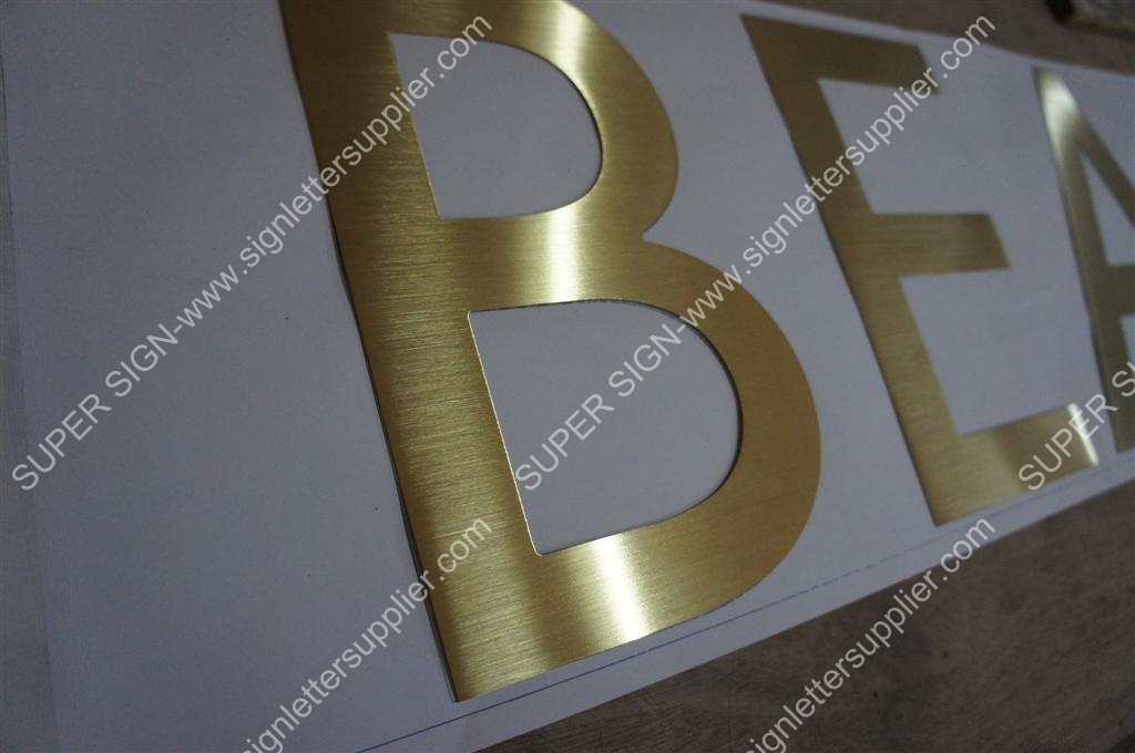 golden color brushed stainless steel sign letter